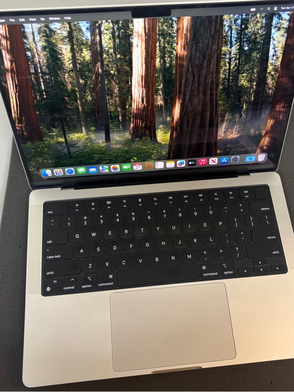 Apple MacBook Pro Silver with Black Screen Bezel and Blue Screen Graphic